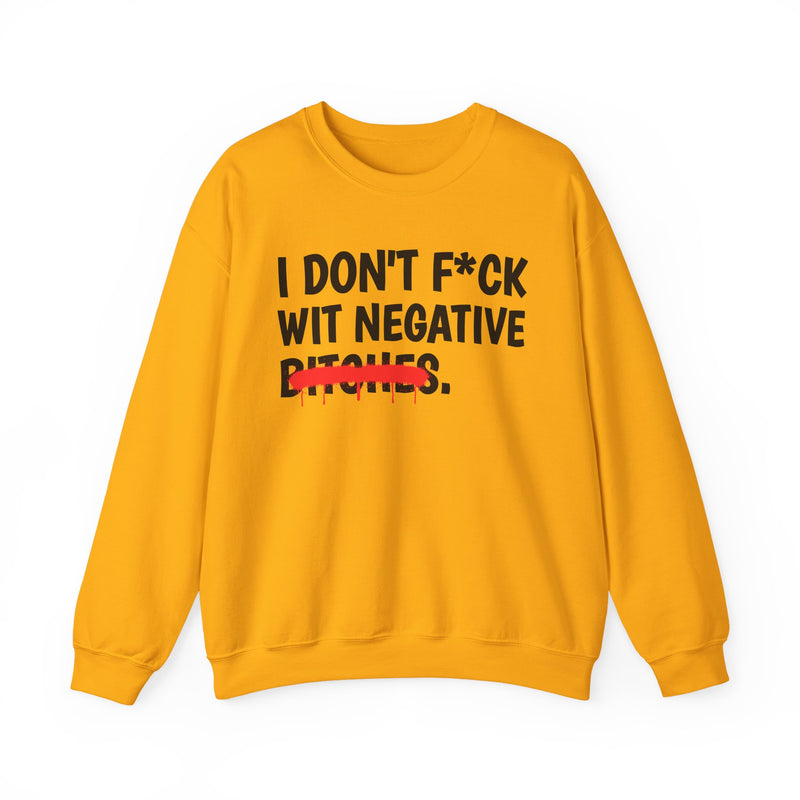 Yellow sweatshirt with gold bold boundary lettering reading I DON'T FUCK WIT NEGATIVE BITCHES, front flat-lay view.