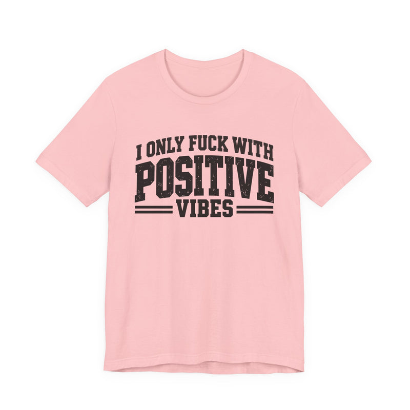 T-Shirt in Pink with lettering reading "I ONLY FUCK WITH POSITIVE VIBES", front view.