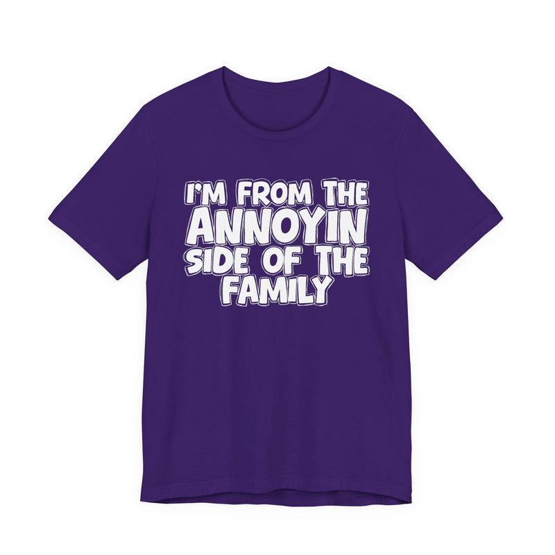 dark t-shirt with ‘I’M FROM THE ANNOYIN SIDE OF THE FAMILY’ statement text in bold outline lettering, front flat-lay view.