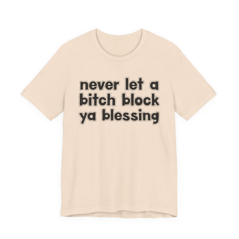 Ash t-shirt with white lettering reading "never let a bitch block ya blessing", front flat-lay view.