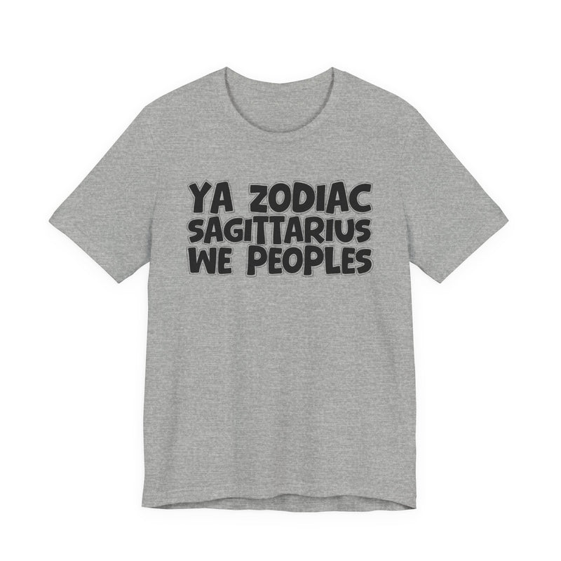 Heather grey t-shirt with black hand-lettered YA ZODIAC SAGITTARIUS WE PEOPLES print, front flat-lay view.