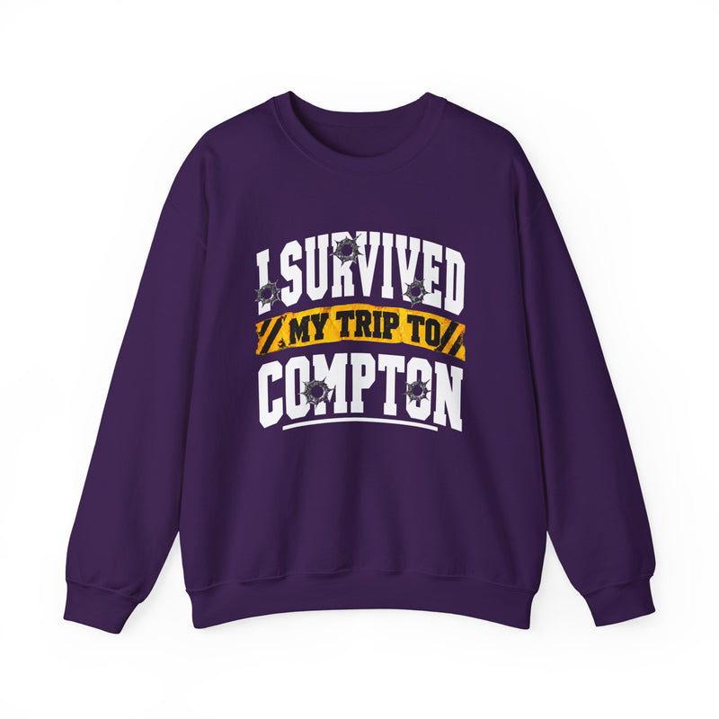 Sweatshirt with collegiate lettering reading I SURVIVED MY TRIP TO COMPTON, front view.