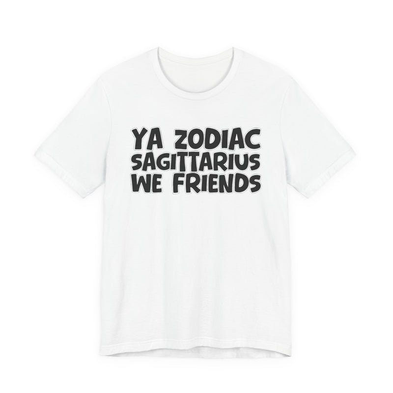 White t-shirt with black 'YA ZODIAC SAGITTARIUS WE FRIENDS' cartoon bubble lettering, front flat-lay view.