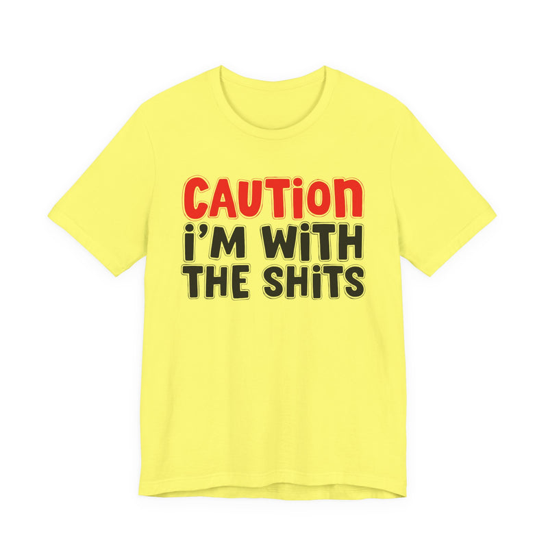 T-Shirt in Yellow with lettering reading "CAUTION I'M WITH THE SHITS", front view.