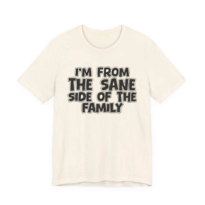 Natural t-shirt, printed with the "I'M FROM THE SANE SIDE OF THE FAMILY" statement in bold outlined bubble lettering, front flat-lay view.