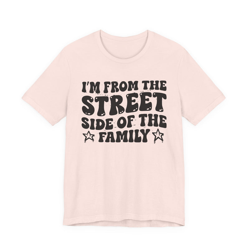 Soft Pink t-shirt with white outlined bubble lettering reading 'I'M FROM THE STREET SIDE OF THE FAMILY', front flat-lay view.