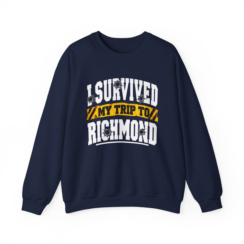 Sweatshirt product photo with arched collegiate lettering reading "I SURVIVED" with bullet-hole decals, a caution-tape band reading "MY TRIP TO", and large block letters reading "RICHMOND", front view.