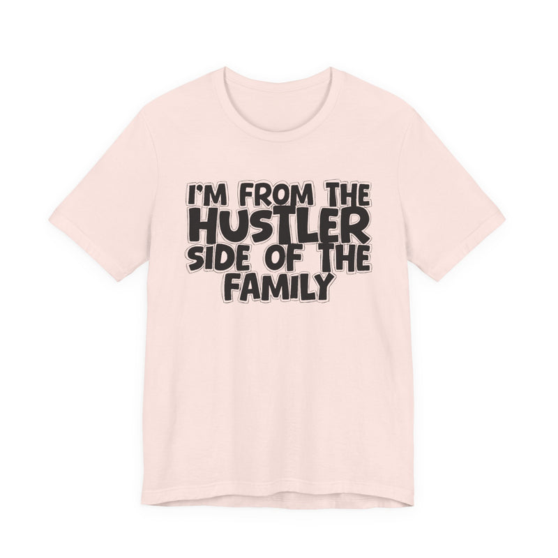 Black Heather t-shirt with bold chest statement text reading 'I'M FROM THE HUSTLER SIDE OF THE FAMILY,' front flat-lay view.