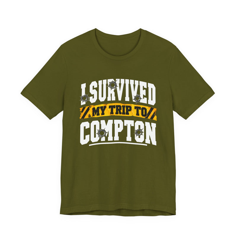 T-Shirt with collegiate lettering reading I SURVIVED MY TRIP TO COMPTON, front view.