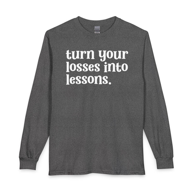 Graphite heather long sleeve t-shirt with white "turn your losses into lessons." lettering, front view.