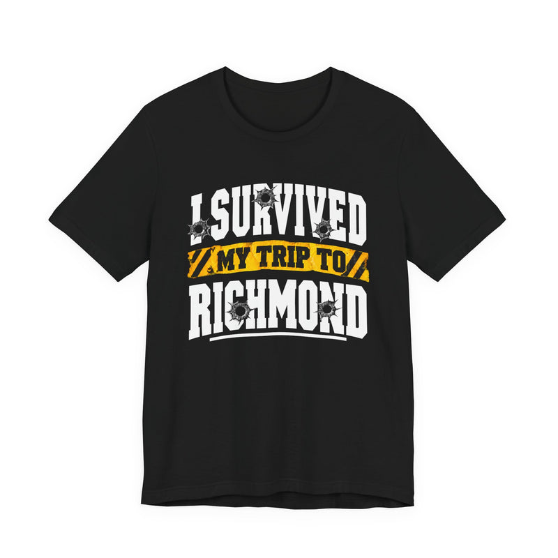 T-Shirt product photo with arched collegiate lettering reading "I SURVIVED" with bullet-hole decals, a caution-tape band reading "MY TRIP TO", and large block letters reading "RICHMOND", front view.
