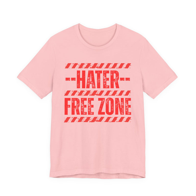 Pink-color tee with distressed yellow lettering reading HATER FREE ZONE, front.