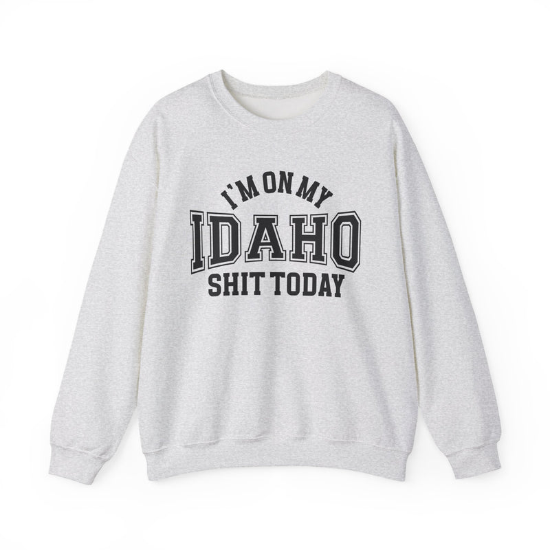 White sweatshirt with black varsity block lettering reading I'M ON MY IDAHO SHIT TODAY, front flat-lay view.