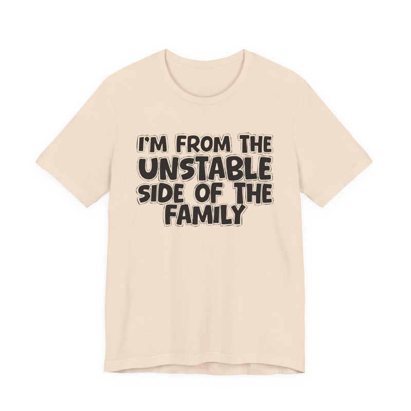 Soft Cream t-shirt with white outlined bubble lettering reading 'I'M FROM THE UNSTABLE SIDE OF THE FAMILY', front flat-lay view.