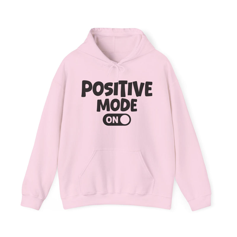 Natural hoodie with white bubble lettering reading "POSITIVE MODE ON", front flat-lay view.
