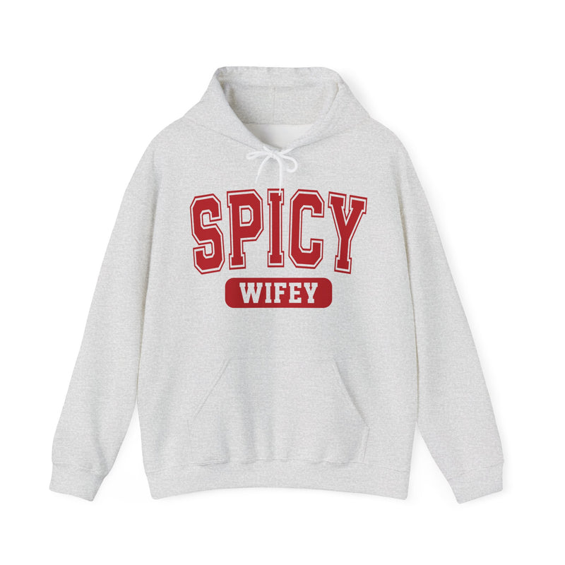 Ash hoodie with dark bold playful lettering reading SPICY WIFEY, front flat-lay view.