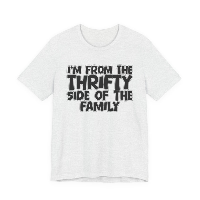 Ash t-shirt with white outlined bubble lettering reading 'I'M FROM THE THRIFTY SIDE OF THE FAMILY', front flat-lay view.
