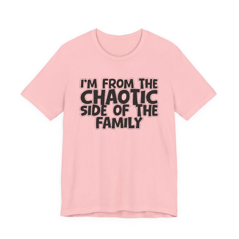 light t-shirt with ‘I’M FROM THE CHAOTIC SIDE OF THE FAMILY’ statement text in bold outline lettering, front flat-lay view.