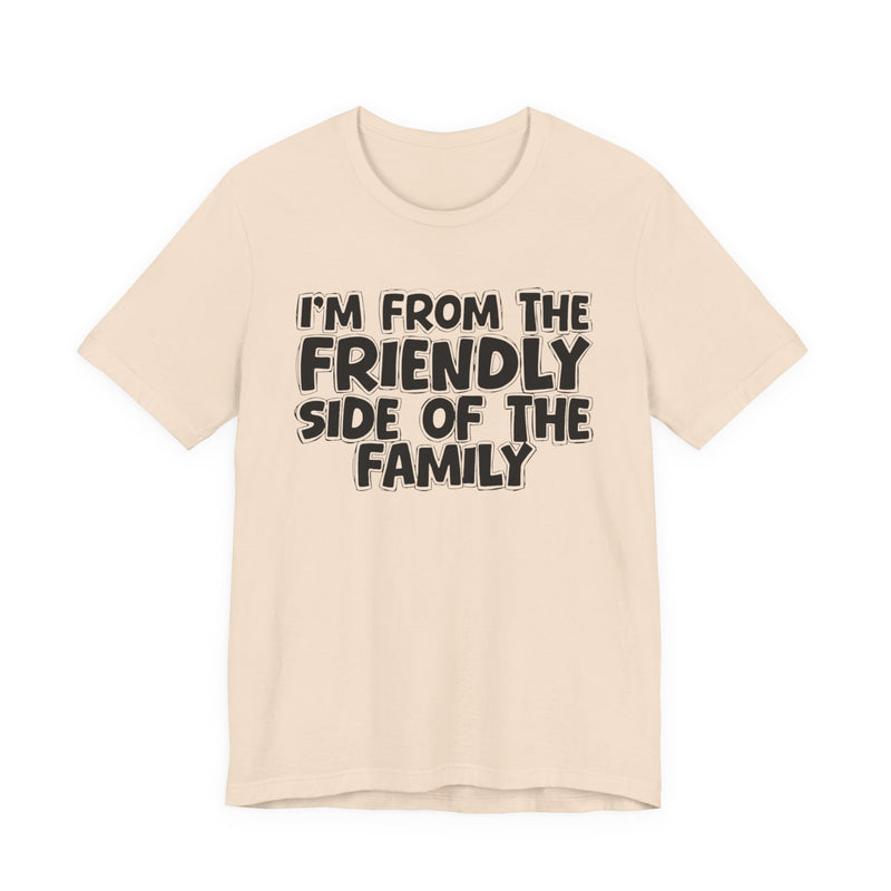 Natural t-shirt with black bubble lettering reading I'M FROM THE FRIENDLY SIDE OF THE FAMILY, front flat-lay view.