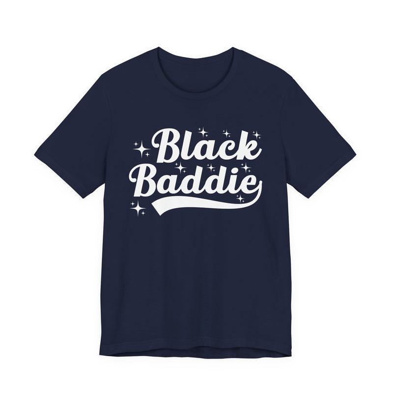 White t-shirt with dark bold statement lettering reading BLACK BADDIE, front flat-lay view.