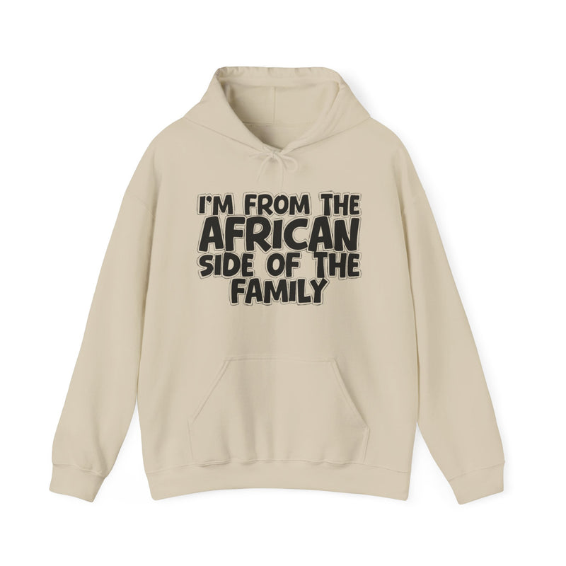 Sand hoodie with drawstring hood and kangaroo pocket with white outlined bubble lettering reading 'I'M FROM THE AFRICAN SIDE OF THE FAMILY', front flat-lay view.