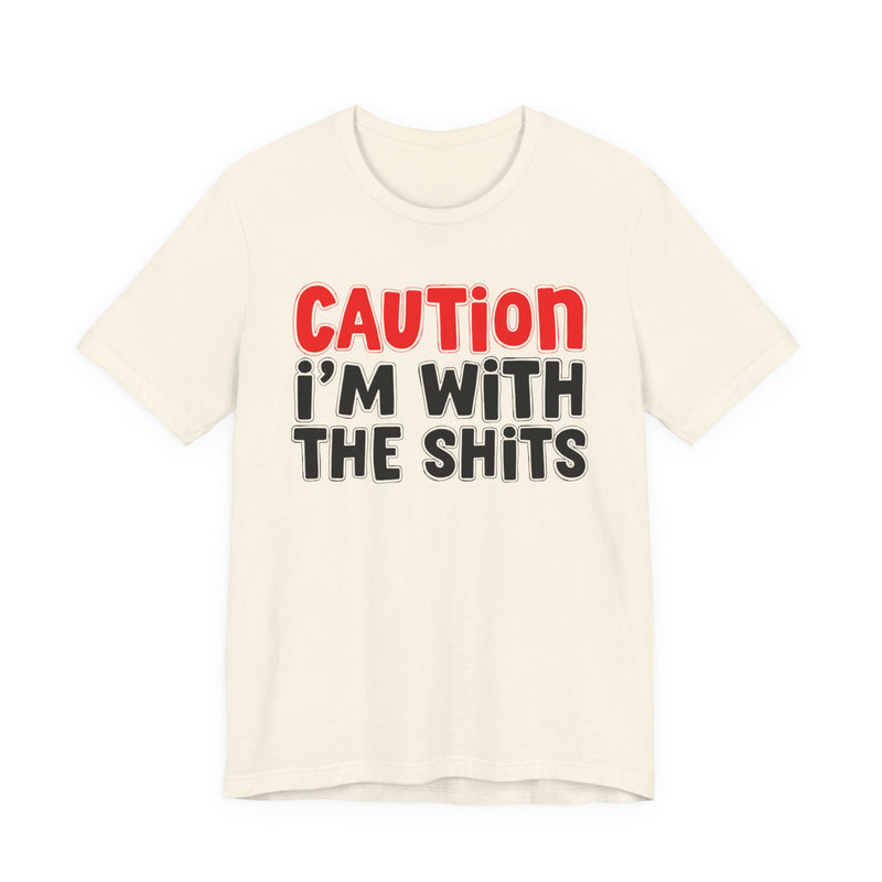 T-Shirt in Natural with lettering reading "CAUTION I'M WITH THE SHITS", front view.