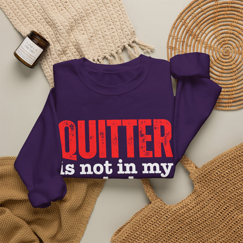 Graphic sweatshirt with bold statement lettering reading "QUITTER IS NOT IN MY VOCABULARY", front view, product mockup