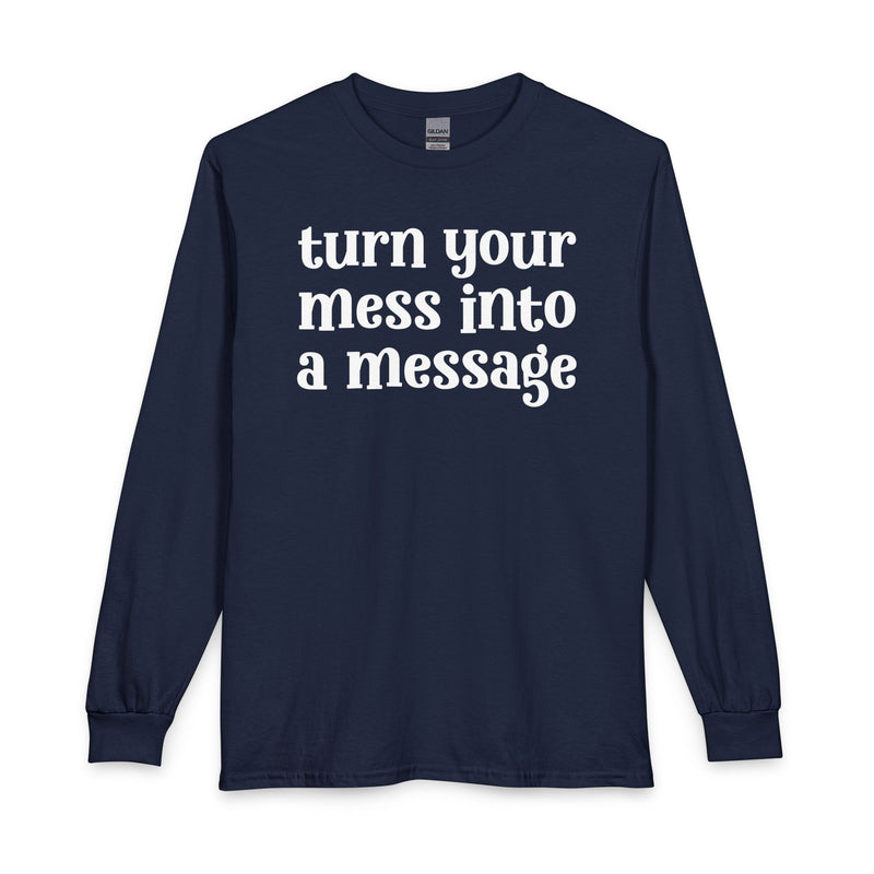 Charcoal long sleeve t-shirt with white lettering reading "turn your mess into a message", front flat-lay view.