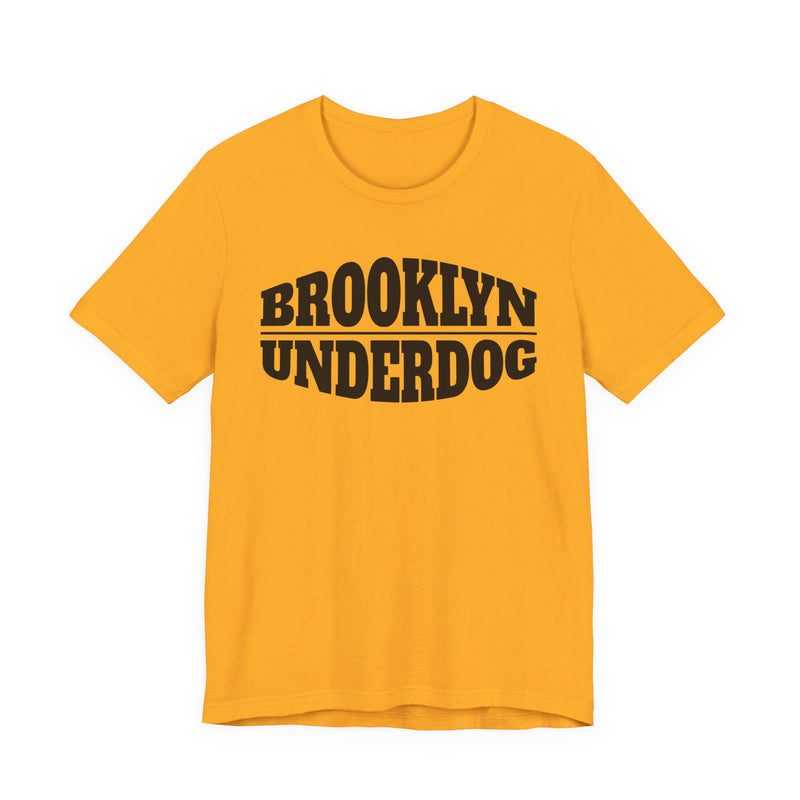Gold T-shirt with black arched BROOKLYN and inverted-arch UNDERDOG collegiate print, front flat-lay view