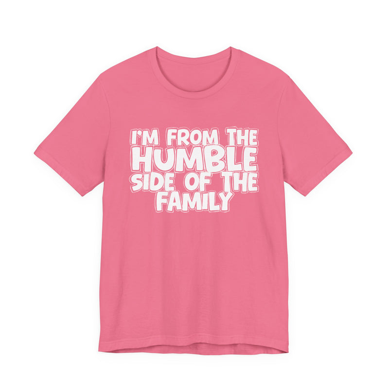light t-shirt with ‘I’M FROM THE HUMBLE SIDE OF THE FAMILY’ statement text in bold outline lettering, front flat-lay view.