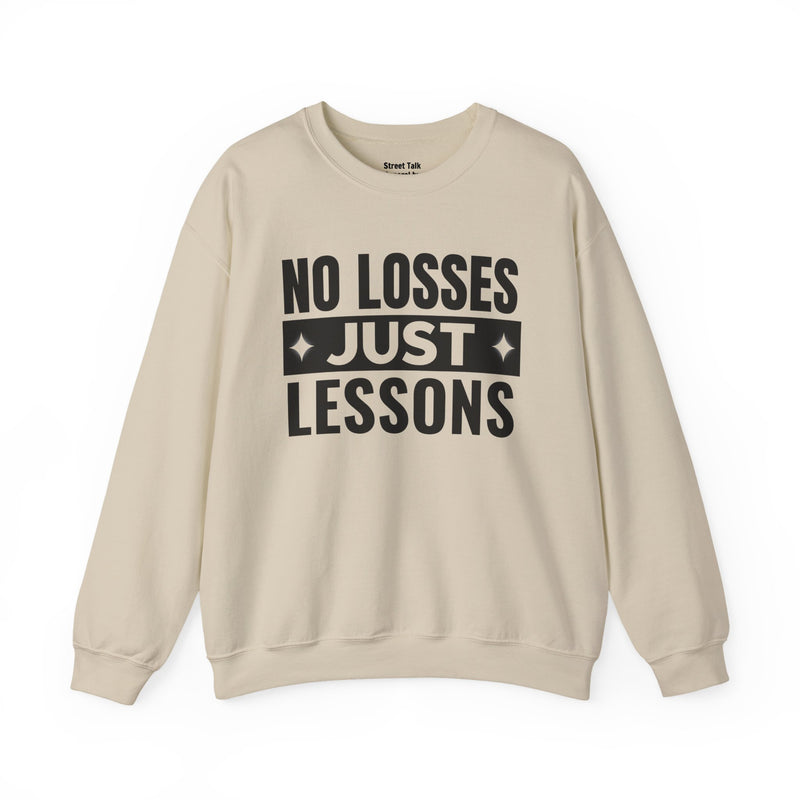 White sweatshirt with black block lettering reading NO LOSSES JUST LESSONS, alternate view.
