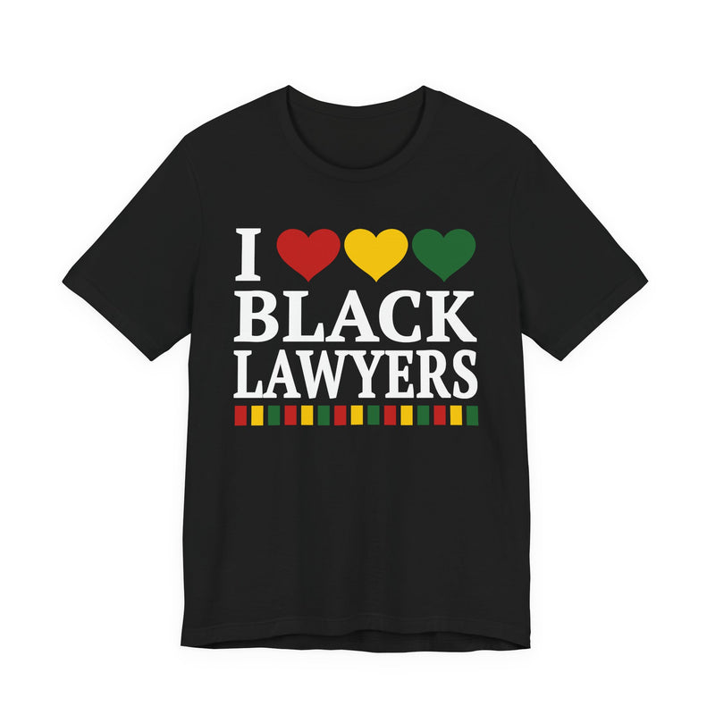 Front flat-lay of the I Love Black Lawyers t-shirt in Black: white 'I' with red, gold, and green hearts above white 'BLACK LAWYERS' collegiate lettering, with a red, gold, and green stripe bar beneath the text.