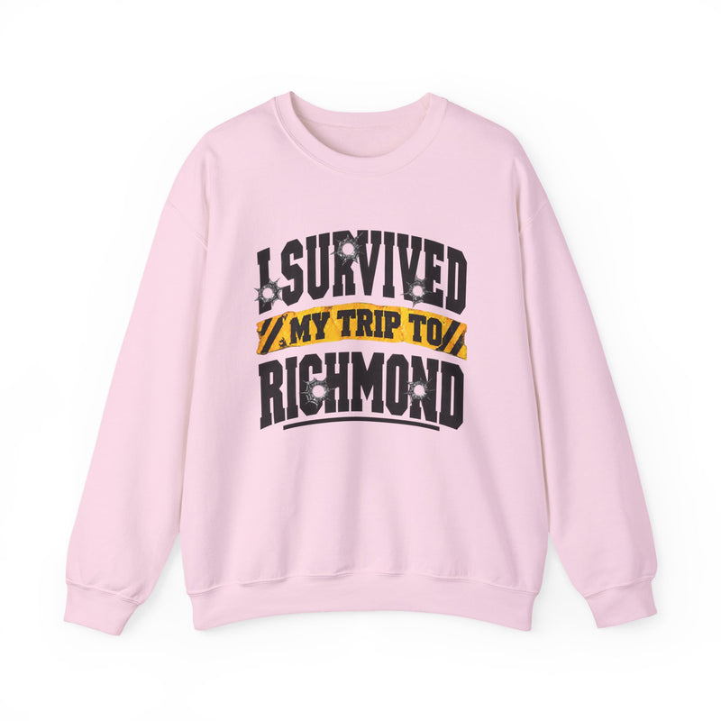 Sweatshirt product photo with arched collegiate lettering reading "I SURVIVED" with bullet-hole decals, a caution-tape band reading "MY TRIP TO", and large block letters reading "RICHMOND", front view.