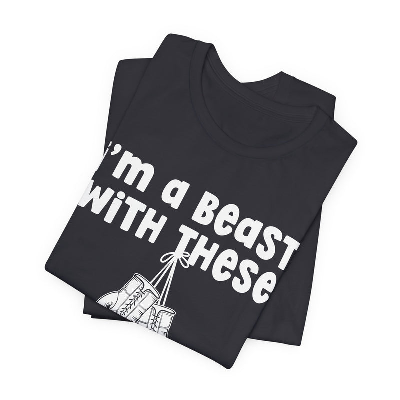 Navy t-shirt with boxing gloves and cream collegiate lettering reading I'M A BEAST WITH THESE, flat-lay view.