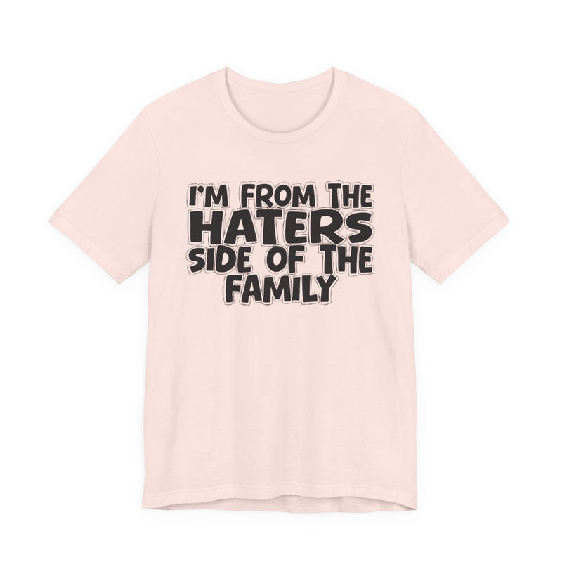 Black t-shirt with bold chest statement text reading 'I'M FROM THE HATERS SIDE OF THE FAMILY,' front flat-lay view.