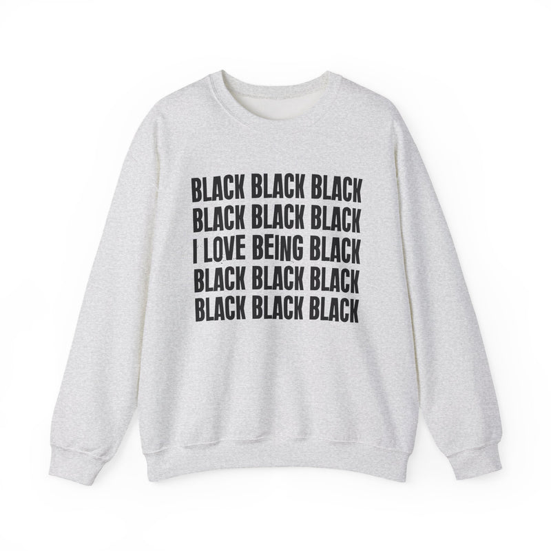 Ash sweatshirt with stacked ‘BLACK BLACK BLACK / I LOVE BEING BLACK / BLACK BLACK BLACK’ block text graphic in dark-contrast print, front flat-lay mockup view