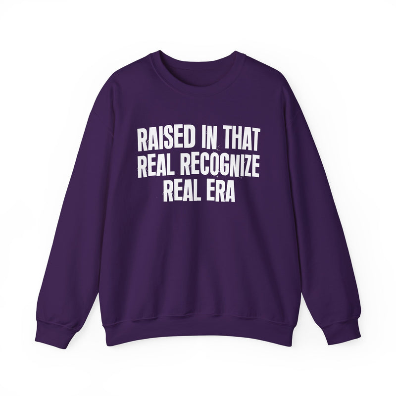 Sweatshirt product with lettering reading "RAISED IN THAT REAL RECOGNIZE REAL ERA", alternate view.