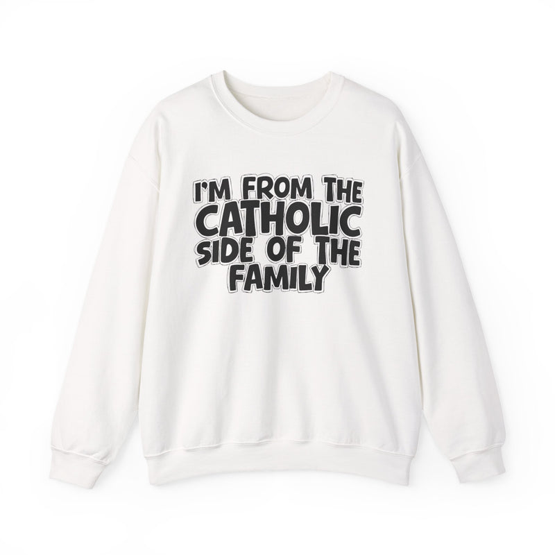 White crewneck sweatshirt with white outlined bubble lettering reading 'I'M FROM THE CATHOLIC SIDE OF THE FAMILY', front flat-lay view.