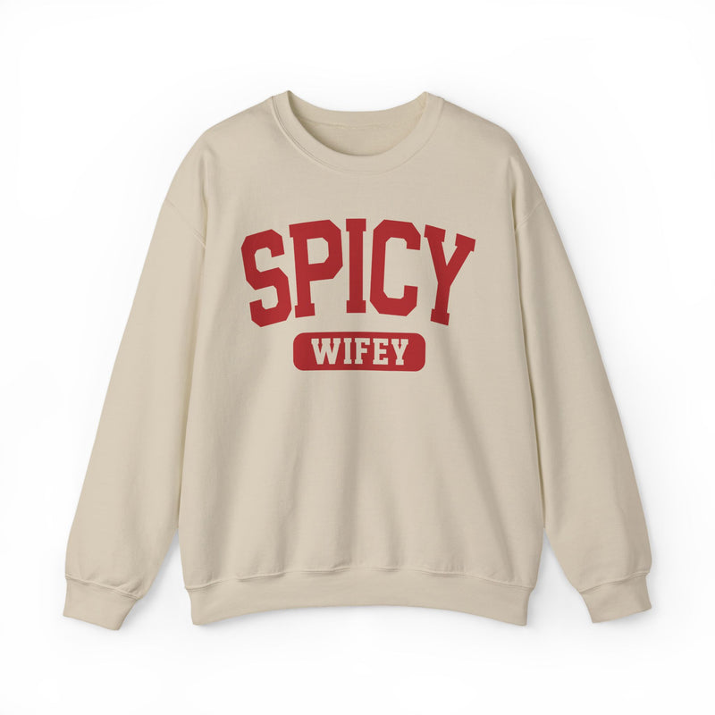 Sand sweatshirt with black statement lettering reading SPICY WIFEY, front flat-lay view.