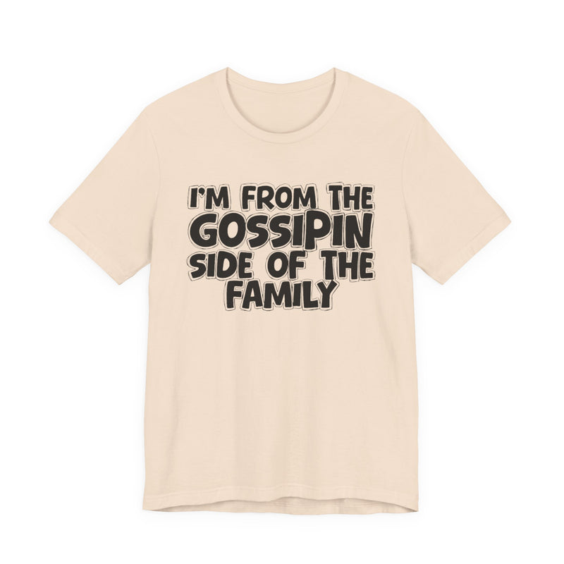 Natural t-shirt with 'I'M FROM THE GOSSIPIN SIDE OF THE FAMILY' in black hand-drawn bubble lettering on the chest, front flat-lay mockup view.