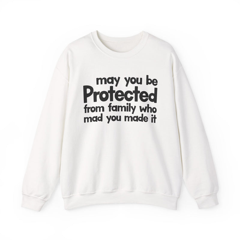 May You Be Protected From Family Who Mad You Made It — Sweatshirt fabric detail close-up: MAY YOU BE PROTECTED FROM FAMILY WHO MAD YOU MADE IT in bold statement lettering. Street Talk Designs protection statement apparel.