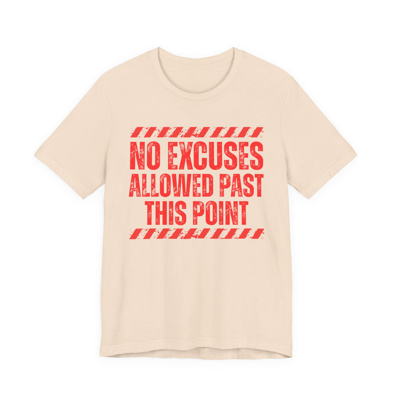 Natural tee with red distressed yellow block lettering reading "NO EXCUSES ALLOWED PAST THIS POINT", front flat-lay view, with caution-stripe bars.
