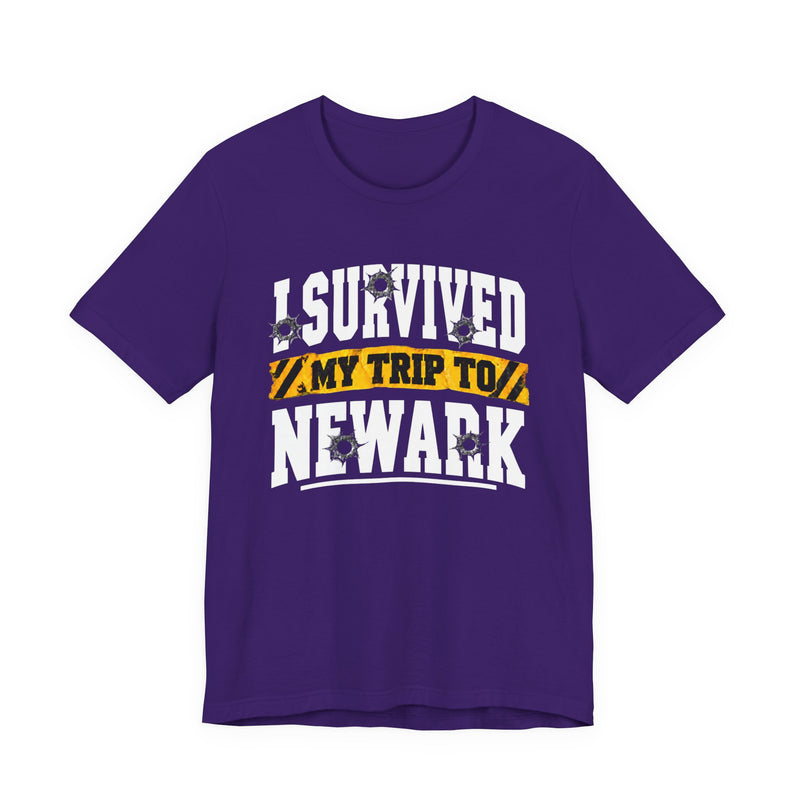 T-Shirt with collegiate lettering reading I SURVIVED MY TRIP TO NEWARK, front view.