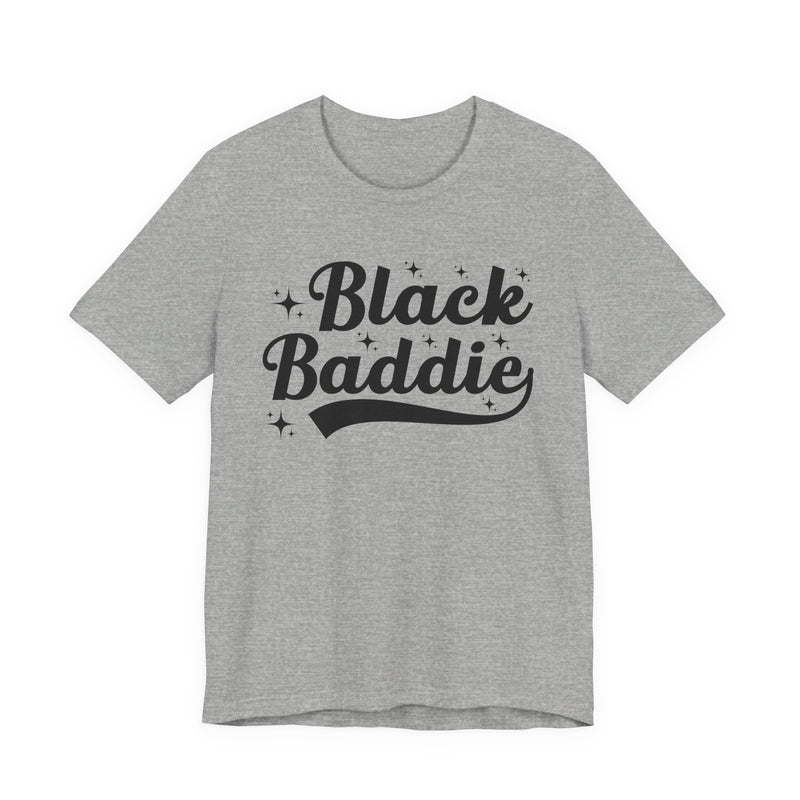 White t-shirt with grey bold statement lettering reading BLACK BADDIE, front flat-lay view.