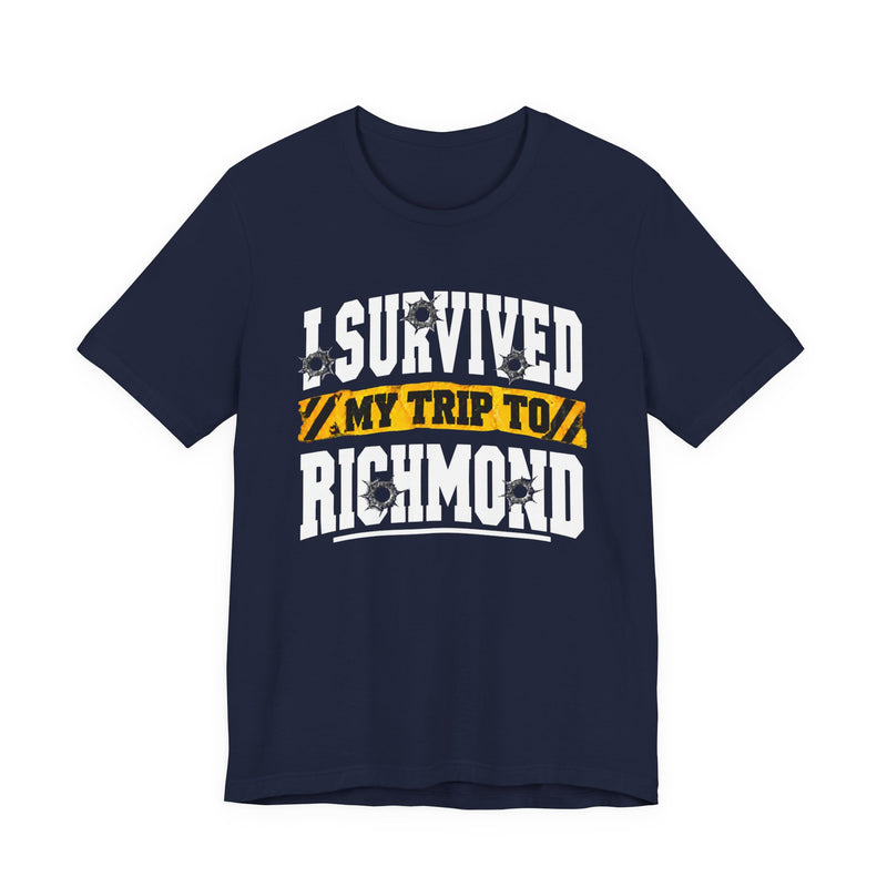 T-Shirt product photo with arched collegiate lettering reading "I SURVIVED" with bullet-hole decals, a caution-tape band reading "MY TRIP TO", and large block letters reading "RICHMOND", front view.