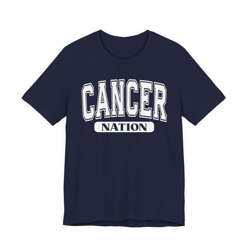 Navy t-shirt with white arched CANCER collegiate lettering over a black NATION pill badge, front flat-lay view.