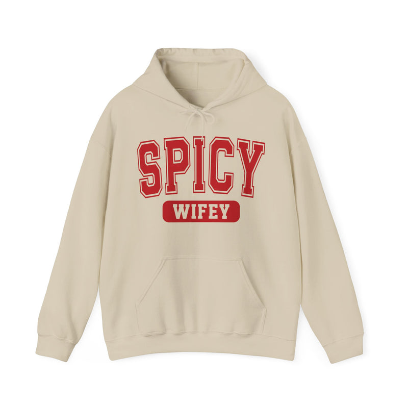 Ash hoodie with dark bold playful lettering reading SPICY WIFEY, front flat-lay view.
