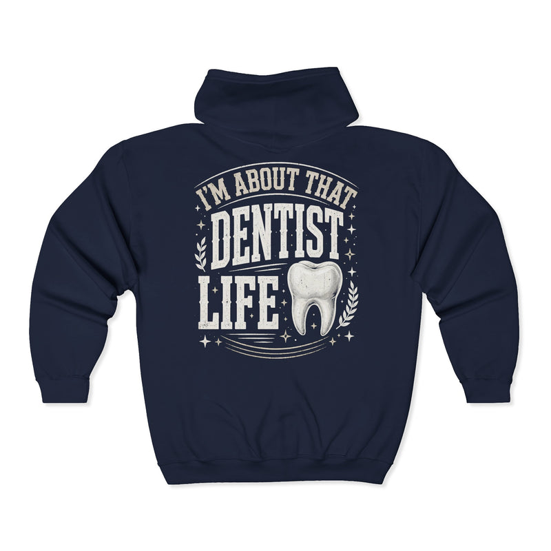 Navy zip hoodie with white bubble lettering reading I'M ABOUT THAT DENTIST LIFE, back view.