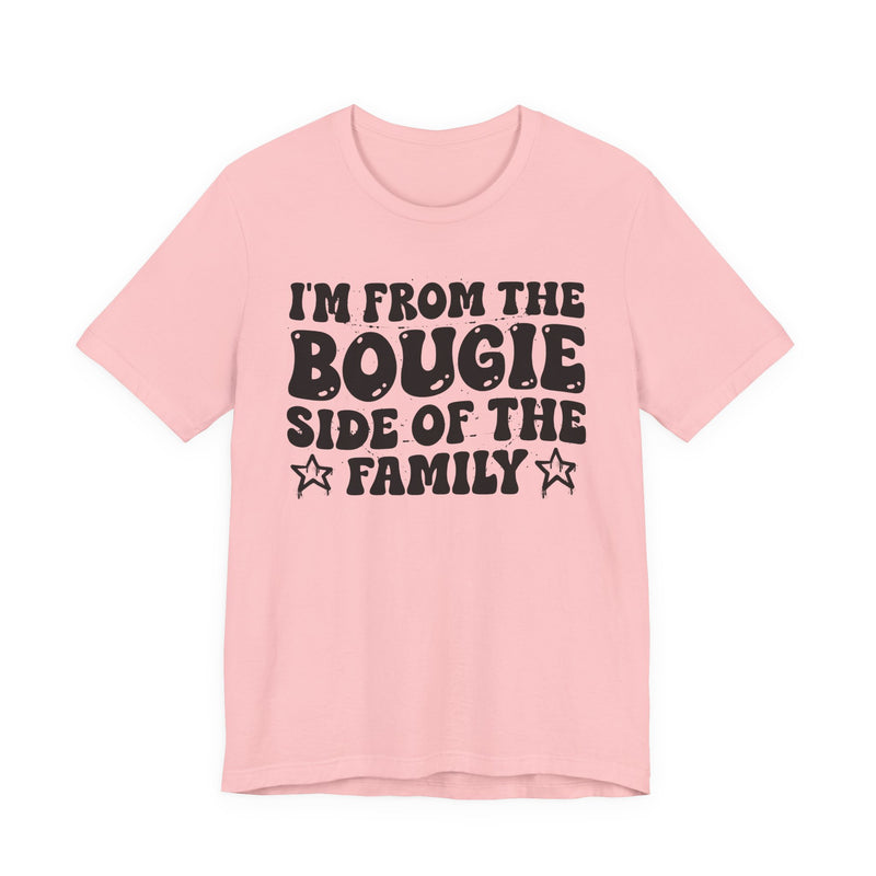 Pink t-shirt with white outlined bubble lettering reading 'I'M FROM THE BOUGIE SIDE OF THE FAMILY', front flat-lay view.