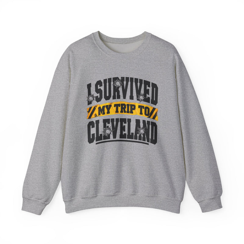 Sweatshirt product with collegiate lettering reading I SURVIVED MY TRIP TO CLEVELAND, detail close-up.